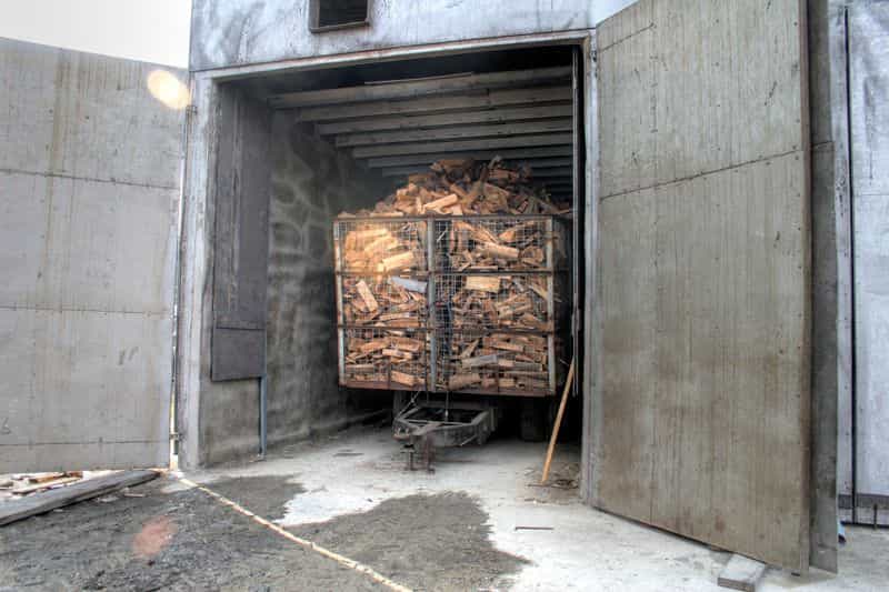 Wagons of firewood in our custom desgined kilns